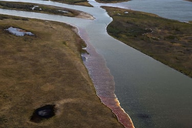 An aerial view shows the pollution in a river outside Norilsk on June 6, 2020. - Russian President Vladimir Putin on June 3, ordered a state of emergency and criticised a subsidiary of metals giant Norilsk Nickel after a massive diesel spill into a Siberian river. The spill of over 20,000 tonnes of diesel fuel took place on May 29, 2020. A fuel reservoir collapsed at a power plant near the city of Norilsk, located above the Arctic Circle, and leaked into a nearby river. (Photo by Irina YARINSKAYA / AFP) (Photo by IRINA YARINSKAYA/AFP via Getty Images)
