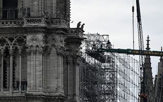 Workers take part in the dismantling operation of the scaffolding at the Notre-Dame Cathedral in Paris on June 8, 2020 that was damaged in the April 15, 2019 blaze. (Photo by Philippe LOPEZ / AFP) (Photo by PHILIPPE LOPEZ/AFP via Getty Images)
