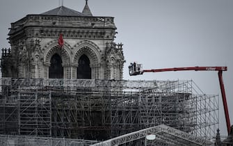1218383946 Workers take part in the dismantling operation of the scaffolding at the Notre-Dame Cathedral in Paris on June 8, 2020 that was damaged in the April 15, 2019 blaze. (Photo by Philippe LOPEZ / AFP) (Photo by PHILIPPE LOPEZ/AFP via Getty Images)