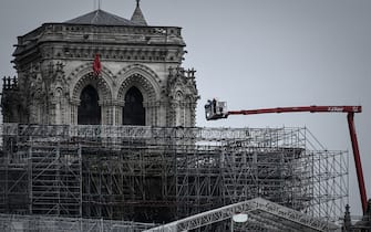 Workers take part in the dismantling operation of the scaffolding at the Notre-Dame Cathedral in Paris on June 8, 2020 that was damaged in the April 15, 2019 blaze. (Photo by Philippe LOPEZ / AFP) (Photo by PHILIPPE LOPEZ/AFP via Getty Images)