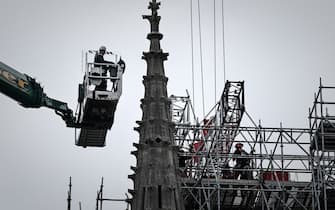 Workers take part in the dismantling operation of the scaffolding at the Notre-Dame Cathedral in Paris on June 8, 2020 that was damaged in the April 15, 2019 blaze. (Photo by Philippe LOPEZ / AFP) (Photo by PHILIPPE LOPEZ/AFP via Getty Images)
