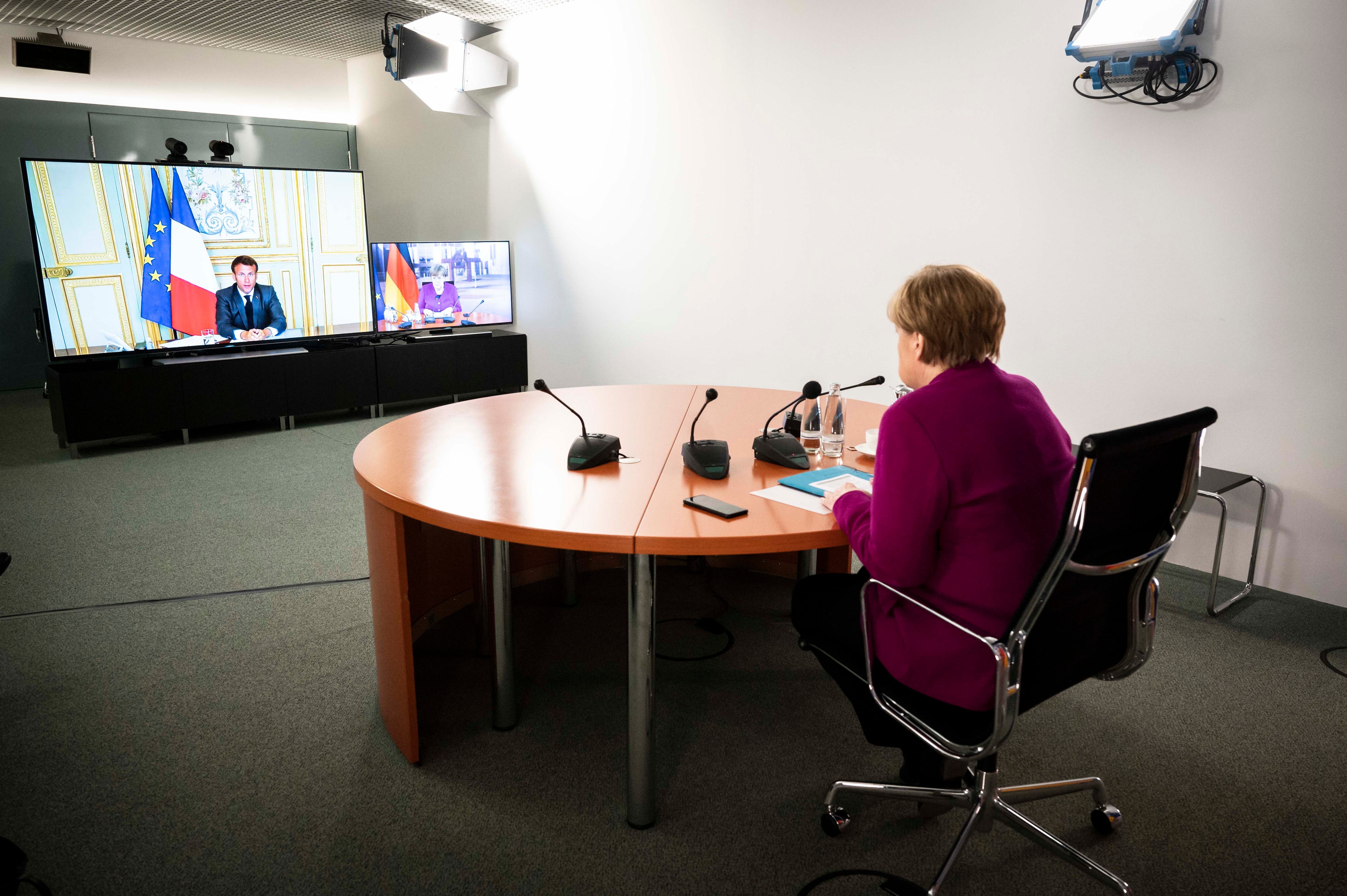1213500043 BERLIN, GERMANY - MAY 18, 2020: In this handout photo provided by the German Government Press Office (BPA), German Chancellor Angela Merkel is seen during a video conference with French President Emmanuel Macron at the Chancellor's Office on May 18, 2020 in Berlin, Germany. (Photo by Sandra Steins/Bundesregierung via Getty Images)