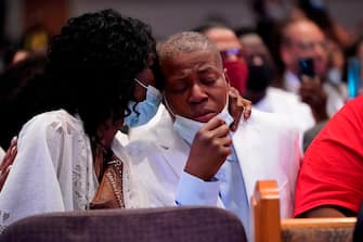 Sisters of George Floyd Zsa Zsa Floyd, embraces her sister LaTonya Floyd during a funeral service for George Floyd at The Fountain of Praise church Tuesday, June 9, 2020, in Houston. - George Floyd will be laid to rest Tuesday in his Houston hometown, the culmination of a long farewell to the 46-year-old African American whose death in custody ignited global protests against police brutality and racism. Thousands of well-wishers filed past Floyd's coffin in a public viewing a day earlier, as a court set bail at $1 million for the white officer charged with his murder last month in Minneapolis. (Photo by David J. Phillip / POOL / AFP) (Photo by DAVID J. PHILLIP/POOL/AFP via Getty Images)