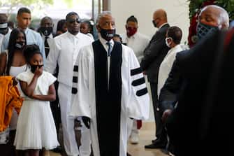 epa08475240 Rev. Al Sharpton enters the church during the funeral for George Floyd at The Fountain of Praise church in Houston, Texas, USA, 09 June 2020. A bystander's video posted online on 25 May, appeared to show George Floyd, 46, pleading with arresting officers that he couldn't breathe as an officer knelt on his neck. The unarmed Black man later died in police custody and all four officers involved in the arrest have been charged and arrested.  EPA/Godofredo A. Vasquez / POOL