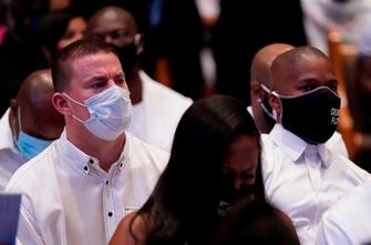 Actor Channing Tatum (L), sits with actor Jamie Foxx (R) during the funeral of George Floyd on June 9, 2020, at The Fountain of Praise church in Houston, Texas. - George Floyd will be laid to rest Tuesday in his Houston hometown, the culmination of a long farewell to the 46-year-old African American whose death in custody ignited global protests against police brutality and racism. Thousands of well-wishers filed past Floyd's coffin in a public viewing a day earlier, as a court set bail at $1 million for the white officer charged with his murder last month in Minneapolis. (Photo by David J. Phillip / POOL / AFP) (Photo by DAVID J. PHILLIP/POOL/AFP via Getty Images)