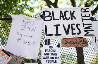 Messages are attached to the security fence on the north side of Lafayette Square, near the White House, in Washington, DC on June 8, 2020. - On May 25, 2020, Floyd, a 46-year-old black man suspected of passing a counterfeit $20 bill, died in Minneapolis after Derek Chauvin, a white police officer, pressed his knee to Floyd's neck for almost nine minutes. (Photo by MANDEL NGAN / AFP) (Photo by MANDEL NGAN/AFP via Getty Images)