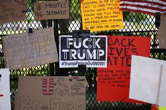 Messages are attached to the security fence on the north side of Lafayette Square, near the White House, in Washington, DC on June 8, 2020. - On May 25, 2020, Floyd, a 46-year-old black man suspected of passing a counterfeit $20 bill, died in Minneapolis after Derek Chauvin, a white police officer, pressed his knee to Floyd's neck for almost nine minutes. (Photo by MANDEL NGAN / AFP) (Photo by MANDEL NGAN/AFP via Getty Images)
