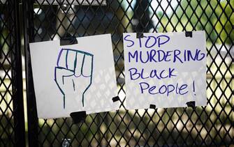 1218644303 Messages are attached to the security fence on the north side of Lafayette Square, near the White House, in Washington, DC on June 8, 2020. - On May 25, 2020, Floyd, a 46-year-old black man suspected of passing a counterfeit $20 bill, died in Minneapolis after Derek Chauvin, a white police officer, pressed his knee to Floyd's neck for almost nine minutes. (Photo by MANDEL NGAN / AFP) (Photo by MANDEL NGAN/AFP via Getty Images)