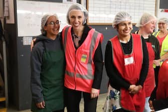 TAURANGA, NEW ZEALAND - JUNE 09: Prime Minister Jacinda Ardern (C) meets and talks to staff during the visit to Trevelyanâ  s Kiwifruit and Avocado Packhouse on June 09, 2020 in Tauranga, New Zealand. COVID-19 restrictions were lifted from midnight as New Zealand moved to COVID-19 Alert Level 1 as the government confirmed there are zero active cases in the country. The lifting of restrictions under Alert Level 1 will see life mostly return to normal in New Zealand, however strict border measures will remain with mandatory isolation and quarantine for any overseas arrivals. New Zealanders are also being asked to keep diaries in the event of a second wave of infections. (Photo by Michael Bradley/Getty Images)