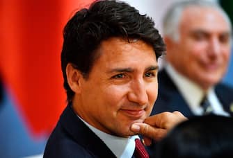 Canada's Prime Minister Justin Trudeau smiles at the start of the "retreat meeting" on the first day of the G20 summit in Hamburg, northern Germany, on July 7. - Leaders of the world's top economies will gather from July 7 to 8, 2017 in Germany for likely the stormiest G20 summit in years, with disagreements ranging from wars to climate change and global trade. (Photo by John MACDOUGALL / various sources / AFP)        (Photo credit should read JOHN MACDOUGALL/AFP via Getty Images)
