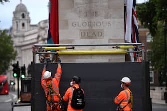 LONDON, ENGLAND - JUNE 11: Workers erect a protective barrier around the Cenotaph in anticipation of protests tomorrow on June 11, 2020 in London, England. Outside the Houses of Parliament, the statue of former Prime Minister Winston Churchill was spray-painted with the words "was a racist" amid anti-racism protests over the weekend. In Bristol, protesters toppled a statue of Edward Colston, a 17th-century slave-trader, and tossed it into the harbor. (Photo by Peter Summers/Getty Images)