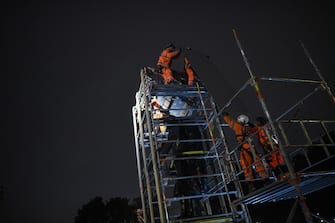 LONDON, ENGLAND - JUNE 11: Workers erect a protective barrier around the statue of Winston Churchill in Parliament Square in anticipation of protests tomorrow on June 11, 2020 in London, England. Outside the Houses of Parliament, the statue of former Prime Minister Winston Churchill was spray-painted with the words "was a racist" amid anti-racism protests over the weekend. In Bristol, protesters toppled a statue of Edward Colston, a 17th-century slave-trader, and tossed it into the harbor. (Photo by Peter Summers/Getty Images)