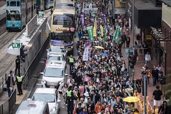 Protesters march along a street during a rally in Hong Kong on March 31, 2019 to protest against the government's plans to approve extraditions with mainland China, Taiwan and Macau. - Critics fear any extradition agreement could leave both business figures and dissidents in Hong Kong vulnerable to China's politicised courts, fatally undermining a business hub that has thrived off its reputation for a transparent and independent judiciary. (Photo by Dale DE LA REY / AFP)        (Photo credit should read DALE DE LA REY/AFP via Getty Images)
