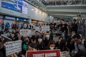 HONG KONG, CHINA - JULY 26: Protesters rally against a controversial extradition bill in the arrivals hall of the international airport on July 26, 2019 in Hong Kong, China. Pro-democracy protesters have continued weekly rallies on the streets of Hong Kong against a controversial extradition bill since 9 June as the city plunged into crisis after waves of demonstrations and several violent clashes. Hong Kong's Chief Executive Carrie Lam apologized for introducing the bill and recently declared it "dead", however protesters have continued to draw large crowds with demands for Lam's resignation and completely withdraw the bill. (Photo by Billy H.C. Kwok/Getty Images)