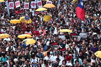 Activists attend a protest in Hong Kong on April 28, 2019, against a controversial move by the government to allow extraditions to the Chinese mainland. - Hong Kong's government has recently announced plans to overhaul its extradition rules, allowing the transfer of fugitives with Taiwan, Macau and mainland China on a "case-basis" for the first time. (Photo by Anthony WALLACE / AFP)        (Photo credit should read ANTHONY WALLACE/AFP via Getty Images)