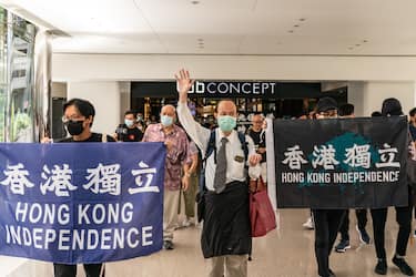 HONG KONG, CHINA - JUNE 12: Pro-democracy supporters hold banners and shout slogans as they march in a shopping mall during a lunch protest on June 12, 2020 in Hong Kong, China. (Photo by Anthony Kwan/Getty Images)