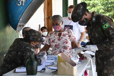 An elderly woman registers to see a doctor of the Brazilian Armed Forces in Palmeiras do Javari, Amazonas state, northern Brazil, on the border with Peru, on June 18, 2020, amid the COVID-19 pandemic. - The Brazilian Armed Forces launched a program to assist isolated populations in the Amazon to help fight the new coronavirus. (Photo by EVARISTO SA / AFP) (Photo by EVARISTO SA/AFP via Getty Images)