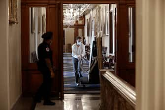 WASHINGTON, DC - JUNE 18: Architect of the Capitol staff use an easel to remove portraits of former Speakers of the House who were also Confederates from the Speaker's Lobby in the U.S. Capitol June 18, 2020 in Washington, DC. The portraits of Hunter, James Orr, Howell Cobb and Charles Crisp were removed on the orders of Speaker Nancy Pelosi (D-CA) ahead of the Juneteenth holiday and in the wake of nationwide protests against police brutality and systemic racism. (Photo by Chip Somodevilla/Getty Images)