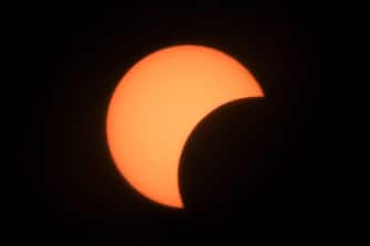 epa08499504 View of a partial solar eclipse as seen from Jerusalem, Israel, 21 June 2020. The partial solar eclipse   which occurs when a portion of the Earth is engulfed by the shadow (penumbra) cast by the Moon as it passes between our planet and the Sun in imperfect alignment   concealed about a third of the solar disk when viewed from the Middle East region.  EPA/ABIR SULTAN
