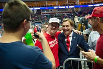 epa08499464 My Pillow CEO Michael J. Lindell (C-R) poses with Supporters of US President Donald J. Trump during a rally inside the Bank of Oklahoma Center in Tulsa, Oklahoma, USA, 20 June 2020. The campaign rally is the first since the COVID-19 pandemic locked most of the country down in March 2020.  EPA/ALBERT HALIM