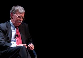 Former National Security adviser John Bolton (R) speaks on stage during a public discussion at Duke University in Durham, North Carolina on February 17, 2020. - Bolton was invited to the school to discuss national security weeks after he was thought of as a key witness in the impeachment trial of President Donald Trump. (Photo by Logan Cyrus / AFP) (Photo by LOGAN CYRUS/AFP via Getty Images)
