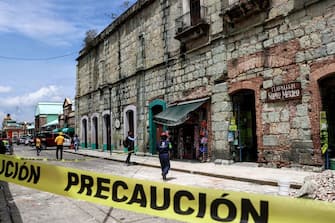 Security tape alerts people of a damaged building after a quake in Oaxaca, Mexico on June 23, 2020. - A 7.1 magnitude quake was registered Tuesday in the south of Mexico, according to the Mexican National Seismological Service. (Photo by PATRICIA CASTELLANOS / AFP) (Photo by PATRICIA CASTELLANOS/AFP via Getty Images)