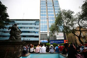 MEXICO CITY, MEXICO - JUNE 23: Sanitary personnel and relatives of patients wait outside the Alvaro Obregon Hospital on June 23, 2020 in Mexico City, Mexico. According to the National Seismological Service a 7.5 magnitude earthquake was registered on Tuesday in Mexico City and in various areas of the country. (Photo by Manuel Velasquez/Getty Images)