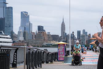 HOBOKEN, NJ - JUNE 15: People wearing protective masks are seen as the city reopens from the coronavirus lockdown on June 15, 2020 in Hoboken, New Jersey. The state has entered Stage 2 of Gov. Phil Murphy's road map for reopening, which includes outdoor dining, in-person retail and child care services with restrictions in place. (Photo by Jeenah Moon/Getty Images)
