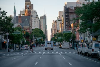 NEW YORK, NEW YORK - JUNE 24: An ambulance without sirens is seen driving up an empty street as the city moves into Phase 2 of re-opening following restrictions imposed to curb the coronavirus pandemic on June 24, 2020 in New York City. Phase 2 permits the reopening of offices, in-store retail, outdoor dining, barbers and beauty parlors and numerous other businesses. New York state plans on re-opening in four phases. (Photo by Alexi Rosenfeld/Getty Images)