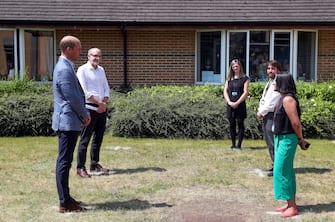 Britain's Prince William, Duke of Cambridge adheres to the Government's social distancing guidelines as he talks to staff at Oxford Vaccine Group's facility at Churchill Hospital in Oxford, west of London on June 24, 2020, during a visit to learn more about the group's work to establish a viable vaccine against the novel coronavirus COVID-19. (Photo by Steve Parsons / POOL / AFP) (Photo by STEVE PARSONS/POOL/AFP via Getty Images)