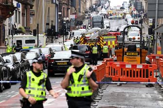 GLASGOW, SCOTLAND - JUNE 26: A general view of emergency services at the scene after reports of three people being killed in a central Glasgow hotel on June 26, 2020 in Glasgow, Scotland. A knifeman stabbed three people to death in the stairwell of the Park Inn Hotel on West George Street, Glasgow before being shot himself by armed police. The Scottish Police Federation (SPF) said an officer was stabbed during the major incident. (Photo by Jeff J Mitchell/Getty Images)