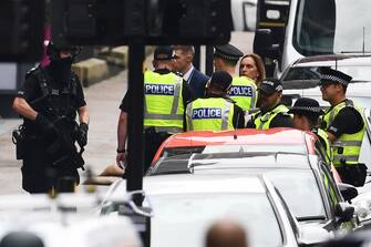 GLASGOW, SCOTLAND - JUNE 26: Police officers speak with witnesses in a cordoned off area after reports of three people being killed in a central Glasgow hotel on June 26, 2020 in Glasgow, Scotland. A knifeman stabbed three people to death in the stairwell of the Park Inn Hotel on West George Street, Glasgow before being shot himself by armed police. The Scottish Police Federation (SPF) said an officer was stabbed during the major incident. (Photo by Jeff J Mitchell/Getty Images)