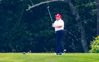 epa08512911 US President Donald J. Trump plays golf at the Trump National Golf Club in Sterling, Virginia, USA, 27 June 2020. On 26 June, Trump abruptly canceled a weekend trip to Bedminster, NJ, tweeting that he 'wanted to stay in Washington, D.C. to make sure LAW & ORDER is enforced.'  EPA/JIM LO SCALZO