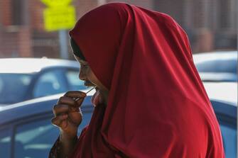 MELBOURNE, AUSTRALIA - JUNE 28: A woman conducts an oral Covid-19 test at a pop-up facility during a COVID-19 testing blitz in the suburb of Broadmeadows on June 28, 2020 in Melbourne, Australia. Victoria's confirmed COVID-19 infection numbers continue to rise, with 49 new coronavirus cases recorded overnight. Health authorities are continuing on a testing blitz in Melbourne suburbs that have been identified as community transmission hotspots for coronavirus. Restrictions in Victoria have been tightened in response to the spike in new cases across the state with premier Daniel Andrews extending the current state of emergency for at least four weeks to allow police the power to enforce social distancing rules. (Photo by Asanka Ratnayake/Getty Images)