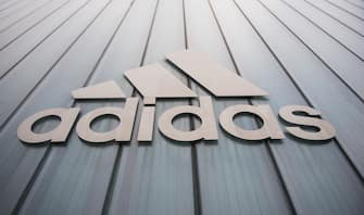 The logo of German sport brand Adidas is pictured on an Outlet Center in Herzogenaurach on January 25, 2016.  / AFP / LUKAS BARTH        (Photo credit should read LUKAS BARTH/AFP via Getty Images)