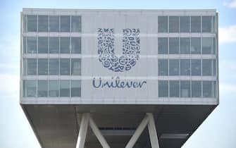 TO GO AFP STORY BY JULIETTE RABAT - A picture taken on June 5, 2015 shows the logo of Unilever at the headquarters in Rotterdam. Unilever is a multinational company in the field of food, personal care and cleaning products. In 1930, Lever Brother, a British soap maker and Margarine, a Dutch company, merged to optimize their requirements and create the multinational Unilever. AFP PHOTO / JOHN THYS (Photo by JOHN THYS / AFP) (Photo by JOHN THYS/AFP via Getty Images)