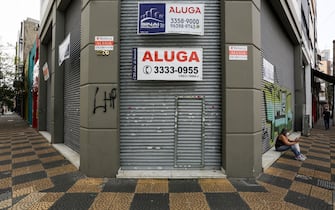 SAO PAULO, BRAZIL - JUNE 29: View of a shuttered shop with a 'For Lease' sign in downtown amidst the coronavirus (COVID-19) pandemic on June 29, 2020 in Sao Paulo, Brazil. Many businesses in the city of Sao Paulo went bankrupt and some commercial spaces are either for sale or for lease during the coronavirus (COVID-19) pandemic. (Photo by Alexandre Schneider/Getty Images)