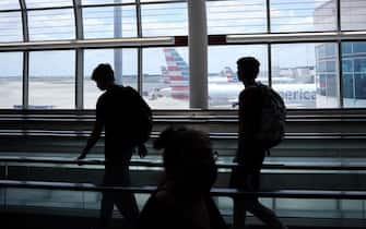 CHARLOTTE,NC  - MAY 15: Passengers walk between terminals at Charlotte Douglas International Airport on May 15, 2020 in Charlotte, North Carolina. Air travel is down an estimated 94 percent due to the coronavirus (COVID-19) pandemic and major U.S. airlines are taking a major financial hit with losses of $350 million to $400 million a day and nearly half of major carriers airplanes are sitting idle.   (Photo by Chris Graythen/Getty Images)