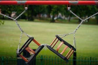LEICESTER, ENGLAND - JUNE 30: Children's play swings remained locked and chained, due to the pandemic, in Spinney Hill Park before non-essential shops close for the localised lockdown on June 30, 2020 in Leicester, England. As the rest of England prepares to reopen pubs and restaurants this weekend, Leicester is closing all non-essential businesses again after a spike in coronavirus cases worried officials. (Photo by Christopher Furlong/Getty Images)