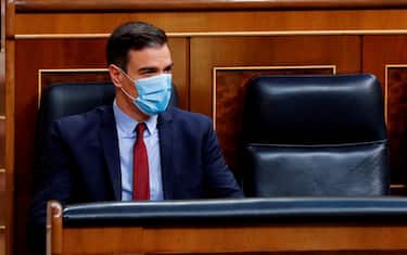 Spanish Prime Minister, Pedro Sanchez wears a face mask during a parliamentary plenary session at the Lower Chamber of Spanish Parliament, in Madrid, on May 20, 2020. - Renewed four times, the state of emergency has let the government impose some of the world's tightest restrictions on Spain's nearly 47 million population, although it has since begun a cautious rollback which is due to finish by late June. (Photo by Andres BALLESTEROS / POOL / AFP) (Photo by ANDRES BALLESTEROS/POOL/AFP via Getty Images)