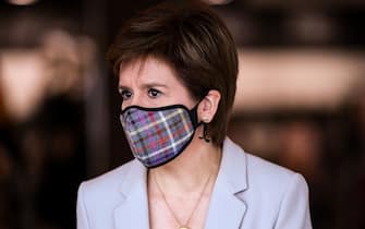 Scotland's First Minister, Nicola Sturgeon wears a Tartan face mask as she visits New Look at Ford Kinaird Retail Park in Edinburgh on June 26, 2020, as Scotland prepares for a further loosening of the COVID-19 lockdown, easing travel restrictions and allowing the re-opening of retailers. (Photo by Jeff J Mitchell / POOL / AFP) (Photo by JEFF J MITCHELL/POOL/AFP via Getty Images)