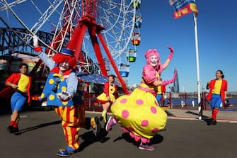 SYDNEY, AUSTRALIA - JULY 03: Showtime performers including Blip the clown and Meringue social distance during a show at Luna Park on July 03, 2020 in Sydney, Australia. Sydney's Luna Park has reopened to the public following its temporary closure on Monday 23 March in response to the COVID-19 pandemic. Restrictions on entertainment venues, weddings, community sport and other gatherings have been eased across NSW since 1 July, but strict physical distancing measures remain in place. (Photo by Lisa Maree Williams/Getty Images)