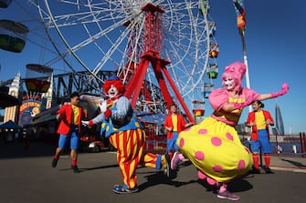 SYDNEY, AUSTRALIA - JULY 03: Showtime performers including Blip the clown and Meringue social distance during a show at Luna Park on July 03, 2020 in Sydney, Australia. Sydney's Luna Park has reopened to the public following its temporary closure on Monday 23 March in response to the COVID-19 pandemic. Restrictions on entertainment venues, weddings, community sport and other gatherings have been eased across NSW since 1 July, but strict physical distancing measures remain in place. (Photo by Lisa Maree Williams/Getty Images)