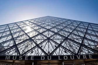 A picture taken on June 23, 2020 shows the Louvre pyramid by Chinese architect Ieoh Ming Pei, the entrance to the Louvre Museum in Paris. - The Louvre museum will reopen its doors on July 6, 2020, after months of closure due to lockdown measures linked to the COVID-19 pandemic, caused by the novel coronavirus. The coronavirus crisis has already caused "more than 40 million euros in losses" at the Louvre, announced its president and director Jean-Luc Martinez, who advocates a revival through "cultural democratization" and is preparing a "transformation plan" for the upcoming Olympic Games in 2024. (Photo by THOMAS SAMSON / AFP) / RESTRICTED TO EDITORIAL USE - MANDATORY MENTION OF THE ARTIST UPON PUBLICATION - TO ILLUSTRATE THE EVENT AS SPECIFIED IN THE CAPTION (Photo by THOMAS SAMSON/AFP via Getty Images)