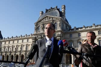 1224905838 Louvre museum director Jean-Luc Martinez answers journalists' questions in front of the Louvre Museum in Paris, on July 6, 2020, on the museum's reopening day. - The Louvre museum will reopen its doors on July 6, 2020, after months of closure due to lockdown measures linked to the COVID-19 pandemic, caused by the novel coronavirus. The coronavirus crisis has already caused "more than 40 million euros in losses" at the Louvre, announced its president and director Jean-Luc Martinez, who advocates a revival through "cultural democratization" and is preparing a "transformation plan" for the upcoming Olympic Games in 2024. (Photo by FRANCOIS GUILLOT / AFP) (Photo by FRANCOIS GUILLOT/AFP via Getty Images)