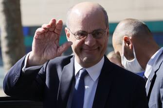 French Education and Youth Affairs Minister Jean-Michel Blanquer waves after visiting a middle school, on June 22, 2020 in Boulogne-Billancourt, outside Paris, as primary and middle schools reopen in France. - After six weeks of unsteady school sessions and more than three months of class at home to fight against the spread of the new coronavirus Covid-19, French pupils and middle school students return to class on June 22, thanks to a lighter health protocol. (Photo by Thomas SAMSON / AFP) (Photo by THOMAS SAMSON/AFP via Getty Images)