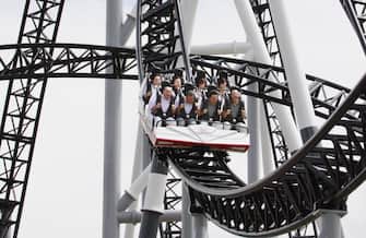 People react as they ride on Fuji-Q Highland amusement park world's steepest roller coaster "Takabisha" with a free falling angle of 121 degrees, at a press preview at Fujiyoshida city in Yamanashi prefecture on July 8, 2011. The  Takabisha stands 43m tall and is 1,000m in distance and will open at the park on the foothills of Mt. Fuji on July 16.   AFP PHOTO / Yoshikazu TSUNO (Photo credit should read YOSHIKAZU TSUNO/AFP via Getty Images)