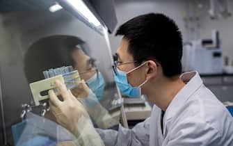 TOPSHOT - In this picture taken on April 29, 2020, an engineer works at the Quality Control Laboratory on an experimental vaccine for the COVID-19 coronavirus at the Sinovac Biotech facilities in Beijing. - Sinovac Biotech, which is conducting one of the four clinical trials that have been authorised in China, has claimed great progress in its research and promising results among monkeys. (Photo by NICOLAS ASFOURI / AFP) / TO GO WITH Health-virus-China-vaccine,FOCUS by Patrick Baert (Photo by NICOLAS ASFOURI/AFP via Getty Images)