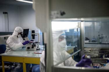 Scientists are at work in the VirPath university laboratory, classified as "P3" level of safety, on February 5, 2020 as they try to find an effective treatment against the new SARS-like coronavirus, which has already caused more than 560 deaths. - When most are busy developing vaccines or testing the few anti-virals available, VirPath will go after drugs used for diseases that have nothing to do with a respiratory infection such as 2019-nCoV. (Photo by JEFF PACHOUD / AFP) (Photo by JEFF PACHOUD/AFP via Getty Images)