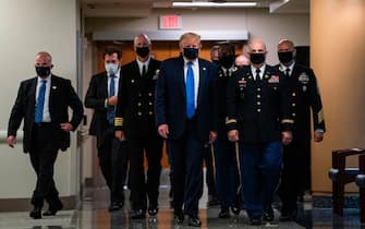 US President Donald Trump wears a mask as he visits Walter Reed National Military Medical Center in Bethesda, Maryland' on July 11, 2020. (Photo by ALEX EDELMAN / AFP) (Photo by ALEX EDELMAN/AFP via Getty Images)